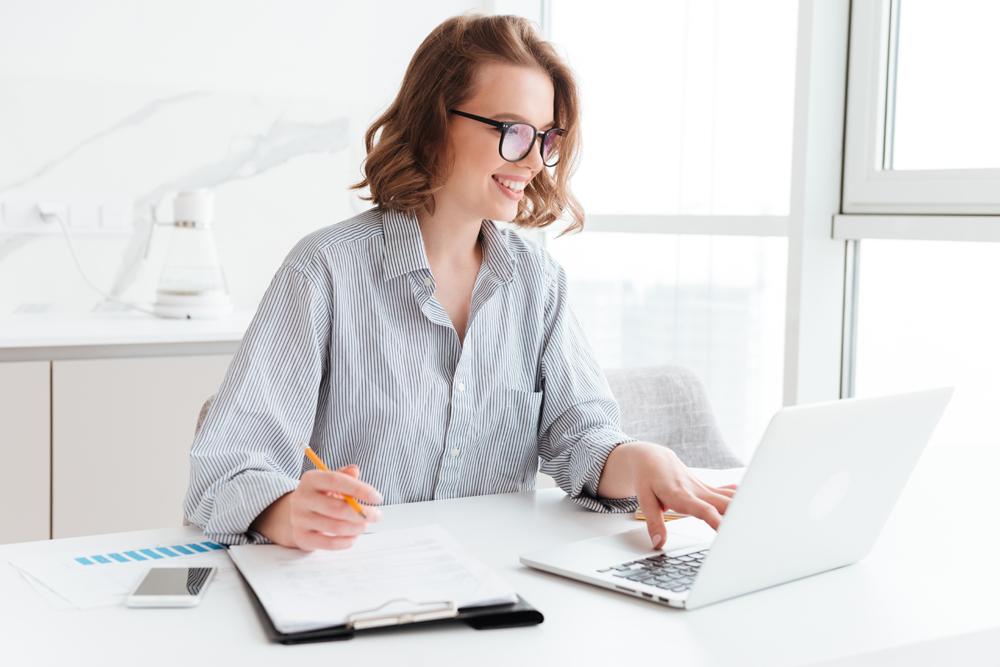 happy-brunette-businesswoman-glasses-using-laptop-computer-while-working-light-apartment.jpg happy-brunette-businesswoman-glasses-using-laptop-computer-while-working-light-apartment.jpg